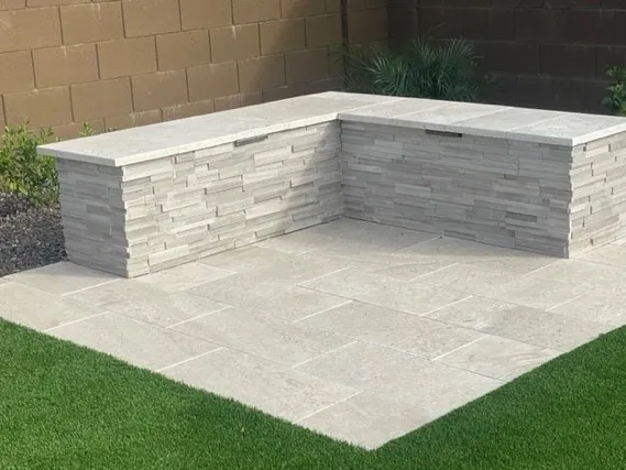 Sitting area of stone and granite with new pavers