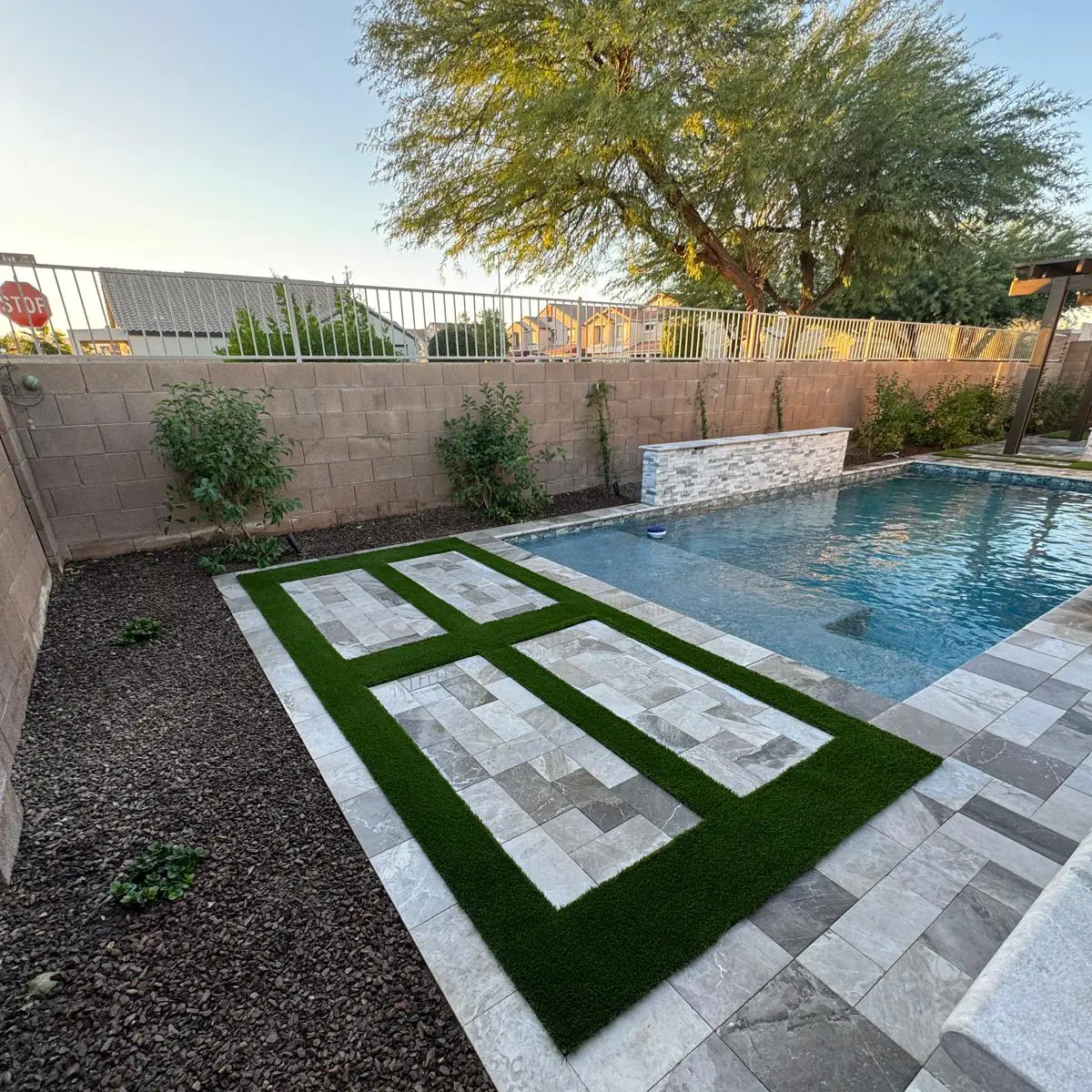 Pool with tree and fence