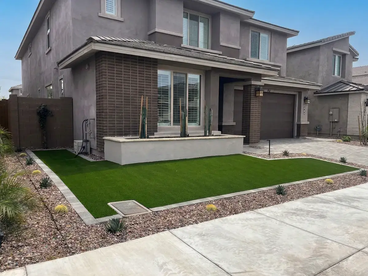 Landscape by Colorworks with small desert plants and artificial turf
