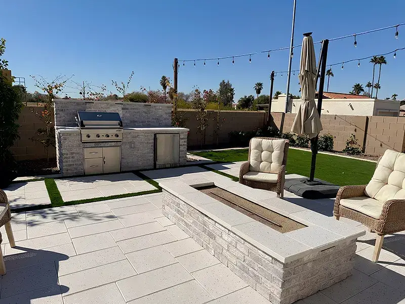 Colorworks Landscaping installation of a backyard kitchen and fire feature