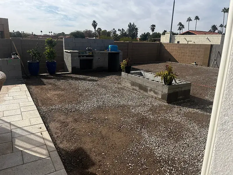 Before photo of Colorworks Landscaping installation of a backyard kitchen and fire feature